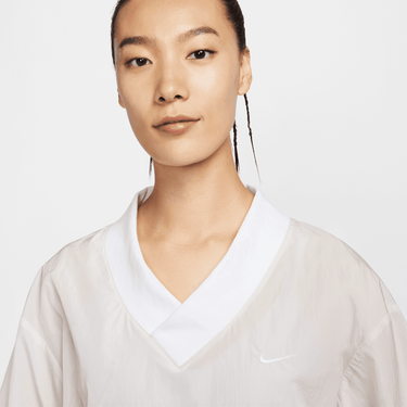 NIKE SPORTSWEAR ESSENTIAL WOMEN'S LOOSE UV WOVEN LONG-SLEEVE V-NECK TOP